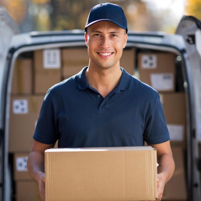 A packhouse worker packing boxes after successfully completing induction training