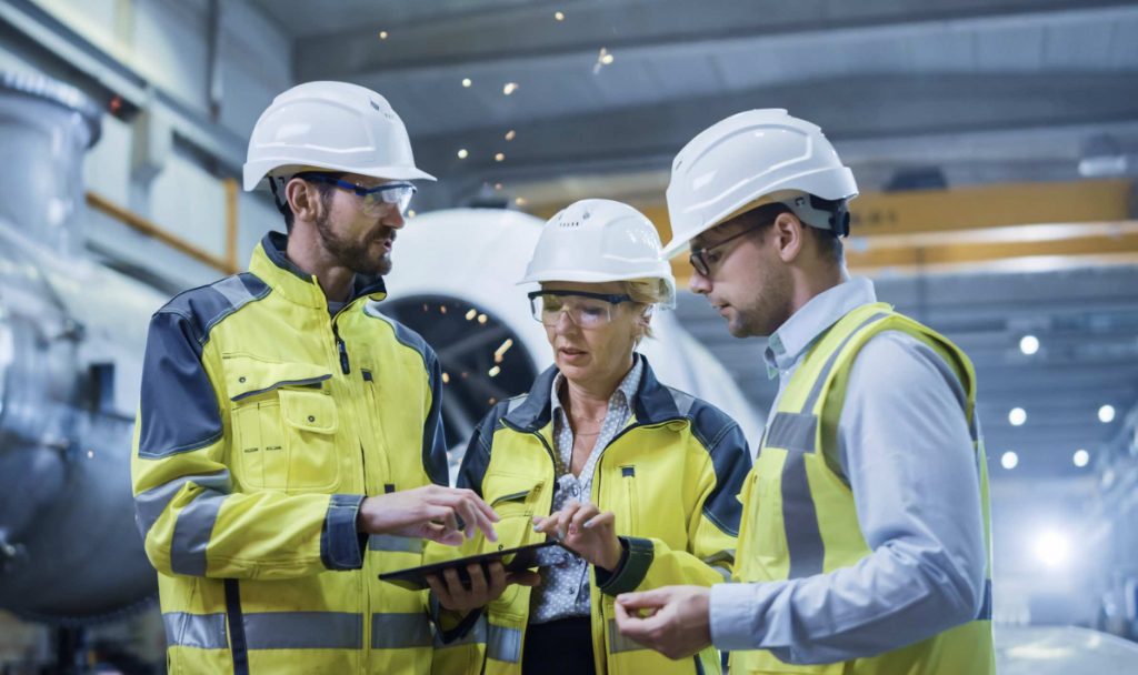 Site Manager having a group discussion at induction training